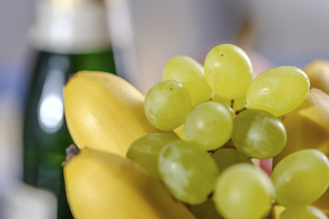 Festive still-life from fresh multicolored fruits on a beautiful background