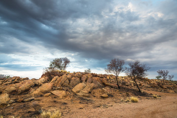 Australian Outback Rocky Dry Desert  Landscape with Dramatic Clouds