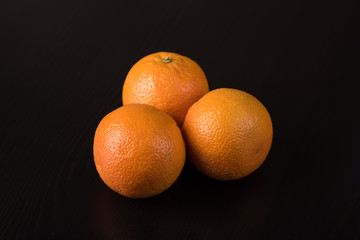 Oranges on black background