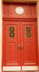 Double door with clock
