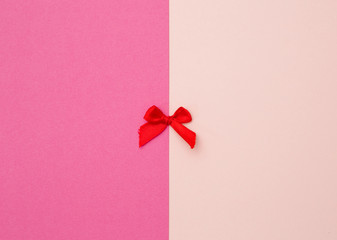 Tiny Red Bow on a Duel Colored Background