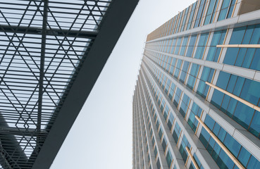 Fototapeta na wymiar Modern architecture steel girders cladding the glass facade of business building