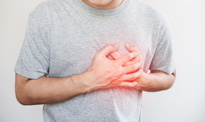 a man touching his heart, with red highlight of heart attack, and others heart disease concept, on white background - 176680764