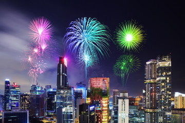 firework over cityscape of Singapore city at night