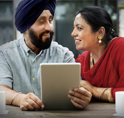 Indian Couple Using Device Concept