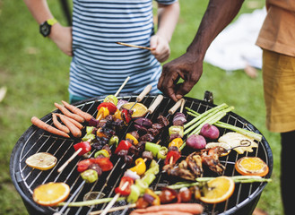 Diverse people enjoying barbecue party together