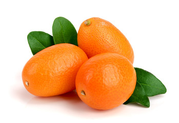 Cumquat or kumquat with leaf isolated on white background close up