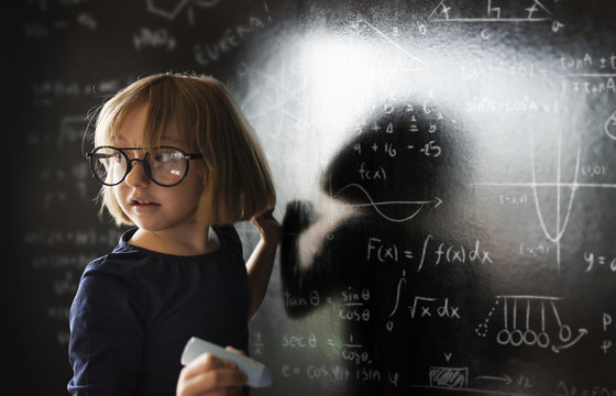 Little genius drawing up some science