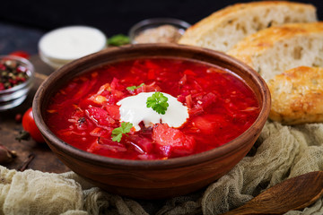 Traditional Ukrainian Russian borscht with white beans on the  bowl.