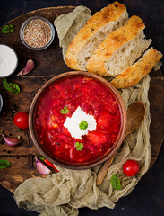 Traditional Ukrainian Russian borscht with white beans on the  bowl.