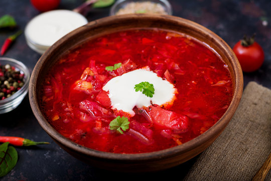 Traditional Ukrainian Russian borscht with white beans on the  bowl.