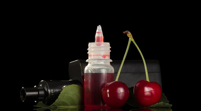 Electronic cigarette with cherry liquid for vaping isolated on black