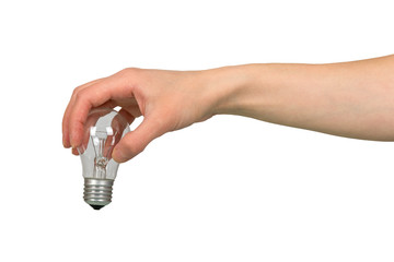 Female hand holding an incandescent lamp isolated on white.