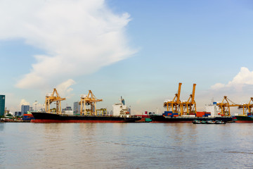 Fototapeta premium Loading container cargo freight ship in container terminal