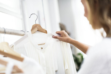 Woman checking out clothes