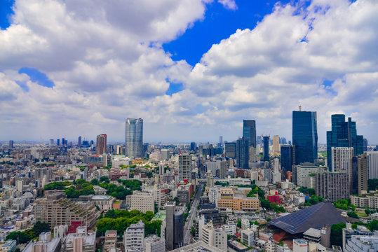 Beautiful city skyline of Downtown Tokyo, Among crowded skyscrapers under blue sunny sky in Tokyo, Japan. Aerial view of busy Tokyo City. 10 October 2017