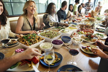 Group of diverse people are having lunch together