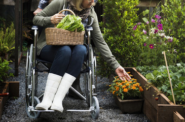 Disabled woman touching the flowers