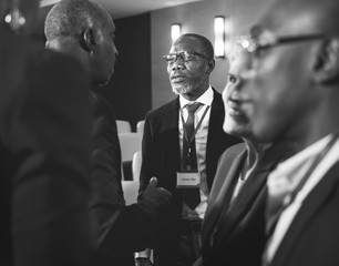 Group of International Businessmen in Suits Talking