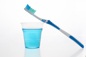 Toothbrush, mouthwash. On a white background