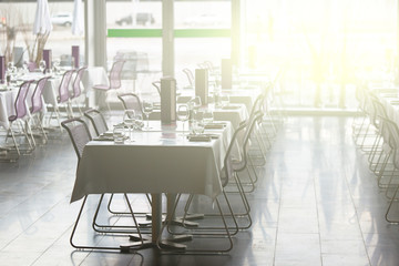 Indoor restaurant tables ready for service