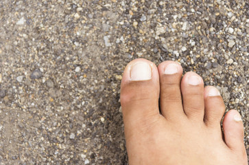 Top view and right foot on sea in summer.
