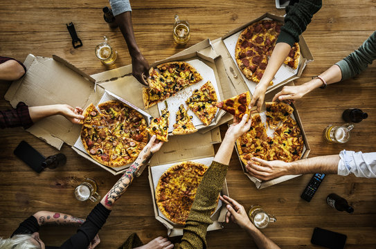 People having a pizza party