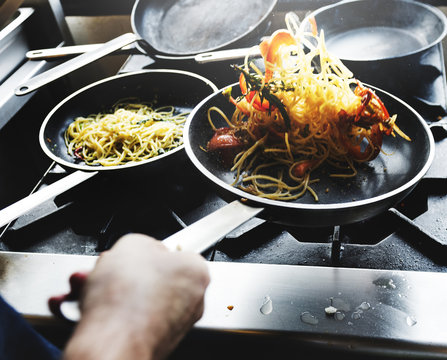 Chef Cooking Spagetti In The Kitchen