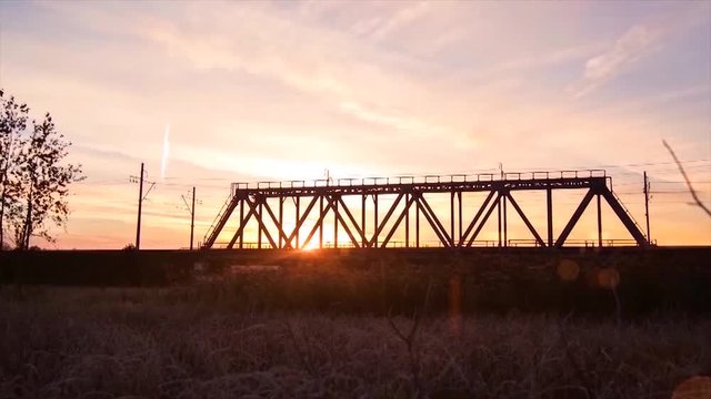 Bridge road. Train traffic transportation. Timelapse railway bridge on sunrise