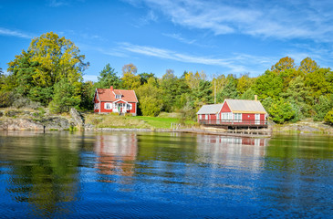Obraz premium Idyllic Swedish landscape with water reflection