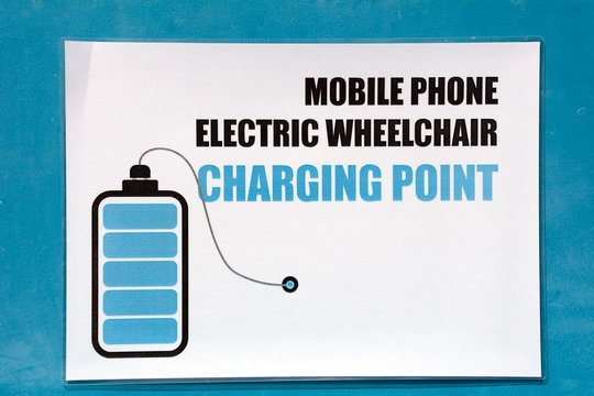 Mobile phone charging point sign in the harbour, Birzebugga, Malta.