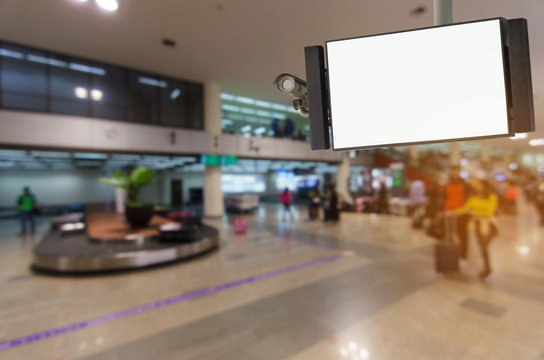 security camera and television blank screen or billboard, copy space for advertising or display media and content with blurred image of people at airport, commercial and marketing concept