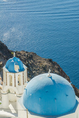 Fototapeta na wymiar view of caldera with classical blue church domes