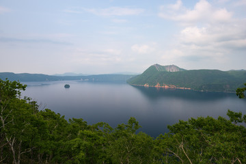 Fototapeta na wymiar Mount Kamui and the beautiful clear blue Lake Mashu, Hokkaido, Japan