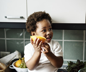 Black kid in the kitchen