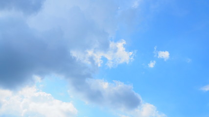 Light blue sky background with white gradient and grey big cloudy chunk on the left, wide screen