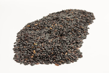heap of black rice - oryza sativa