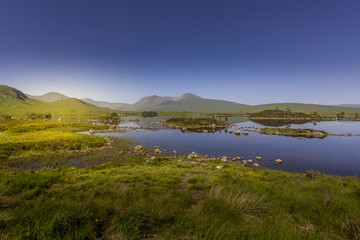Fototapeta na wymiar Rannoch Moor is a vast boggy landscape in the Highlands of Scotland, with many hills, mountains and small lochs