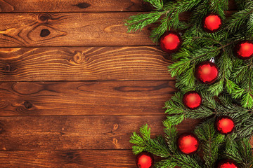 Obraz na płótnie Canvas Christmas fir tree with decoration on a wooden board