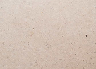 Beige particle pressed wood panel of oriented strand board (OSB) texture background in light brown cream sepia color .