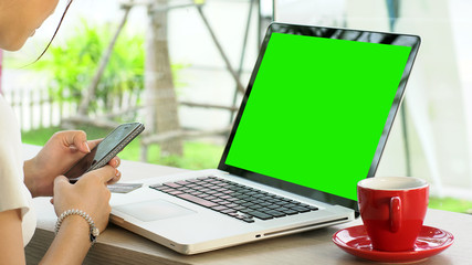 Young Asian Teenage girl using a laptop computer to buy products from an online store with credit card, online surfing and chatting with friends on the social network