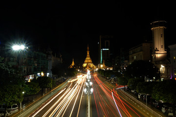 Long exposure slow speed shutter of Sule pagoda in Myanmar with the traffic nearby at night