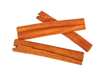 Top view of three cinnamon sticks on a white background