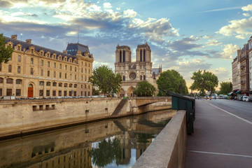 Notre Dame cathedral in Paris, France. Scenic view with river Seine.  Summer travel background.