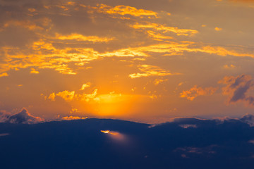 Background of gold clouds in the blue sky before sunset.