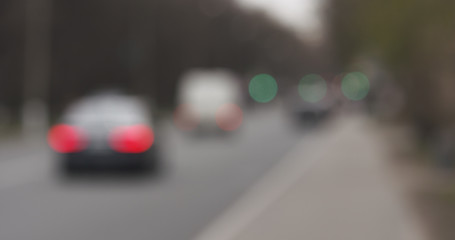 blurred background of traffic in town at daytime