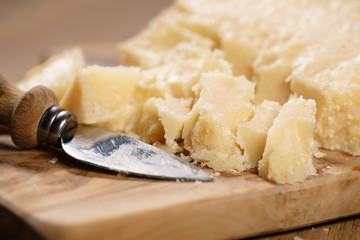 traditional grana padano italian cheese on olive board