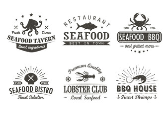 Fototapeta premium Set of vintage seafood, barbecue, grill logo templates, badges and design elements. Logotypes collection for seafood shop, cafe, restaurant. Vector illustration. Hipster and retro style.