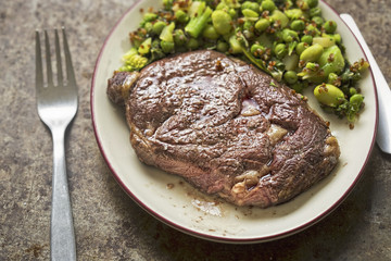 Steak with green vegetables