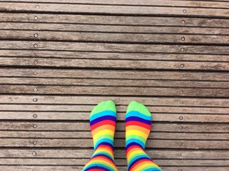 Rainbow colored socks on dock